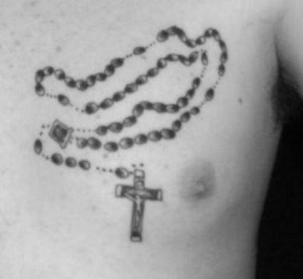 Cross Amulet Chest Tattoo