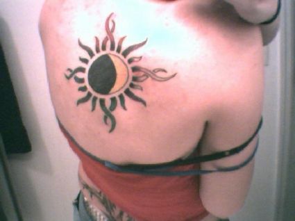 Sun And Moon Tattoo On Back