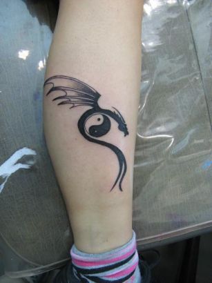 Yin Yang And Dragon Tattoo On Arm