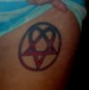 pentagram symbol tattoo on left rib cage