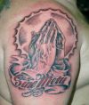 praying hand arm tattoo