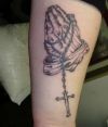praying hand and cross amulet tattoo