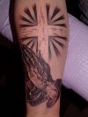 praying hand and cross tatoo