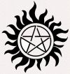sun and pentagram tattoo