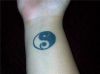 yin yang tattoo on wrist