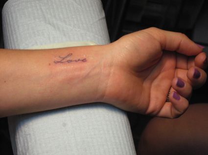 Love Text Tattoo On Wrist 