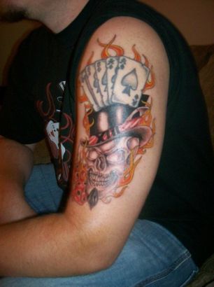 Cards And Skull Arm Tattoo