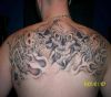 gambling tattoo on man's back
