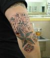gambling tattoo on elbow