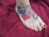 geek tattoo on feet