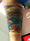 military tattoo on thigh