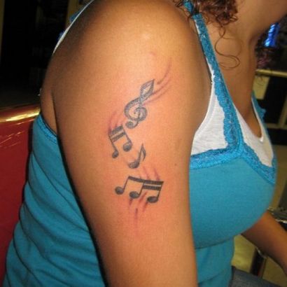 Music Tat On Girl's Arm