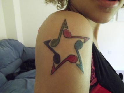 Star Music Tattoo On Arm