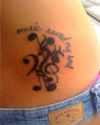 music tattoo on backs