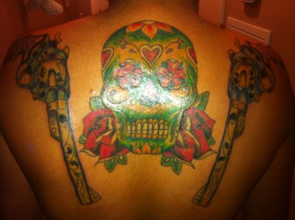 Skull And Guns Tattoo On Back