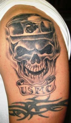 Skull And Tribal Tat On Arm