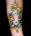 skull tattoo with green flame