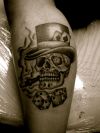 skull tat with dice