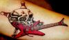skull tat with guitar