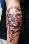 skull hand tat 