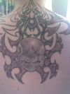 skull man's back tat