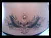 skulls and wings tat