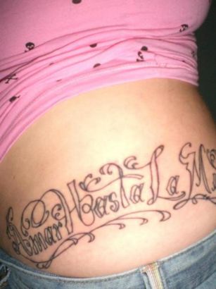 Text Tattoo On Girl's Back