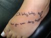 text feet tattoo