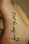 Text tattoo of foot