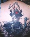 demon image tattoo on back
