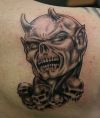 demon skulls tattoo on back