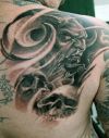 demon tattoo image on right shoulder blade
