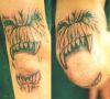 demon tattoo on elbow