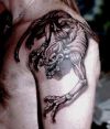 demon tattoos pic on shoulder of guy