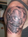 japanese demon face tattoo on arm