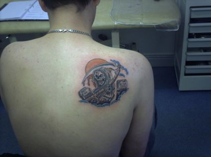 Grim Reaper Tattoo On Right Shoulder Blade Of Man