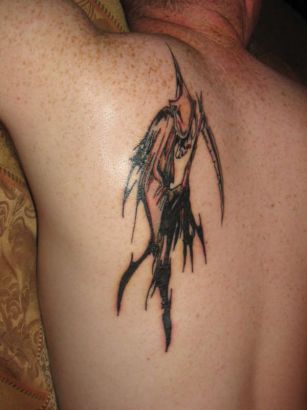 Tribal Reaper Tattoo On Back