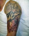 grim reaper and skulls tattoo on arm
