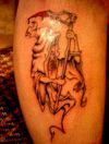 grim reaper image tattoo on arm