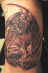 grim reaper tattoo on arm