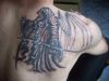 grim reaper tattoo on right shoulder blade