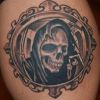 grim reaper tattoo on thigh