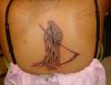 grim reaper tattoos on back of girl