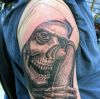 grim reaper tattoos on right arm