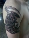 reaper tattoo on arm