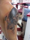 reaper tattoo on shoulder