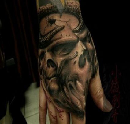 Vampire Face Tattoo On Hand