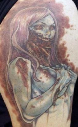 Zombie Tattoo On Man Biceps