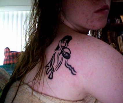 Aquarius Pic Tattoo On Back Of Girl