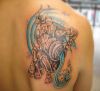 aquarius tattoos pic on right shoulder blade